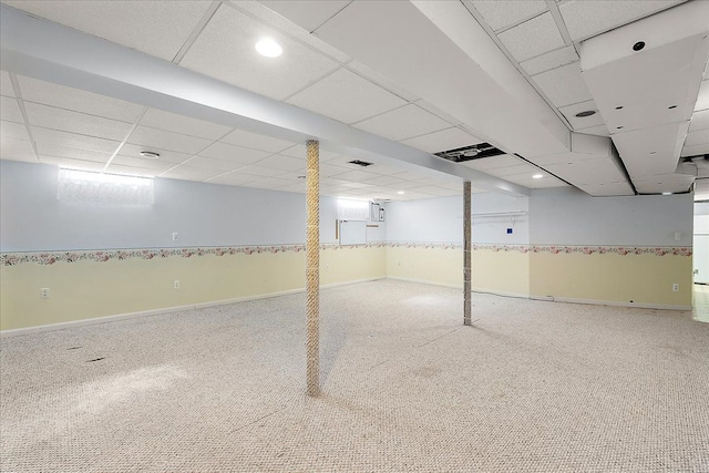 basement with baseboards, recessed lighting, a paneled ceiling, and carpet flooring