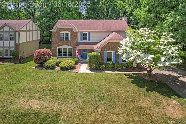 1710 Dawncrest Dr, West Bloomfield, MI 48324 - view of front of property featuring a chimney, a front yard, and brick siding