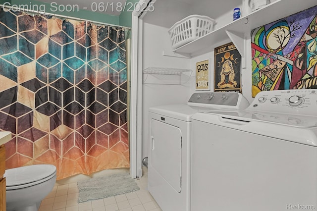 1710 Dawncrest Dr, West Bloomfield, MI 48324 - laundry area with washing machine and clothes dryer and tile patterned flooring