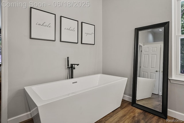 1710 Dawncrest Dr, West Bloomfield, MI 48324 - full bathroom featuring a freestanding bath and wood finished floors