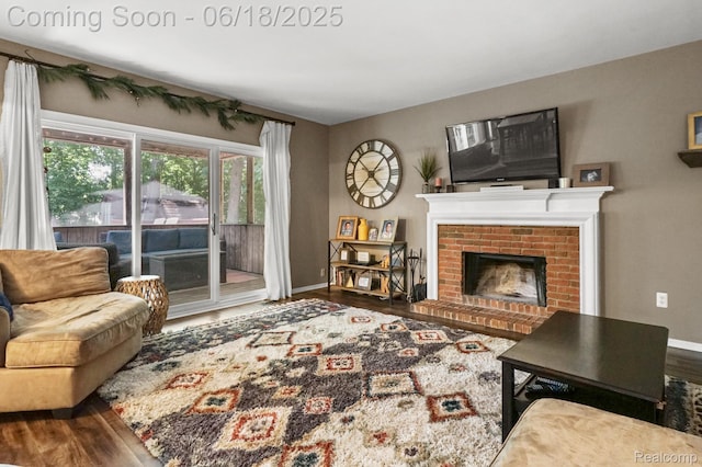 1710 Dawncrest Dr, West Bloomfield, MI 48324 - living area featuring wood finished floors and a brick fireplace