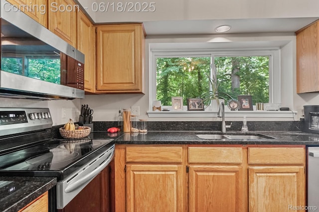 1710 Dawncrest Dr, West Bloomfield, MI 48324 - kitchen with appliances with stainless steel finishes and dark stone counters