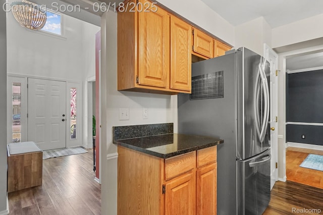 1710 Dawncrest Dr, West Bloomfield, MI 48324 - kitchen featuring freestanding refrigerator, dark wood finished floors, and dark stone countertops