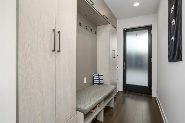 mudroom with dark wood finished floors