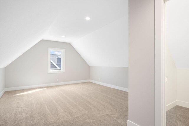 1493 Eagle Shore Ct Unit 37, Hudsonville, MI 49426 - bonus room featuring carpet flooring, baseboards, and vaulted ceiling