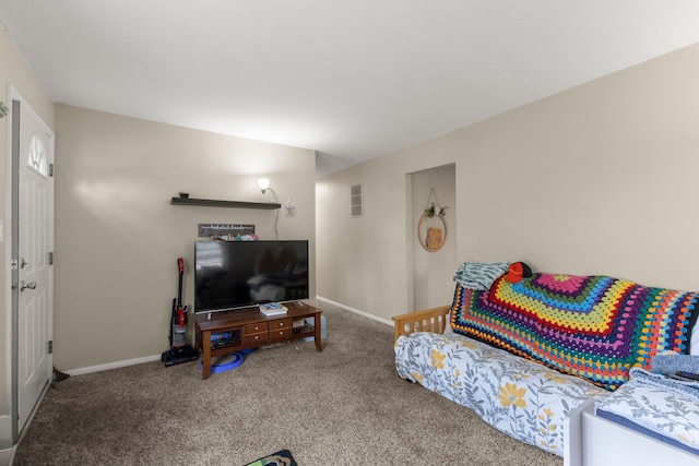 living room featuring visible vents, carpet flooring, and baseboards