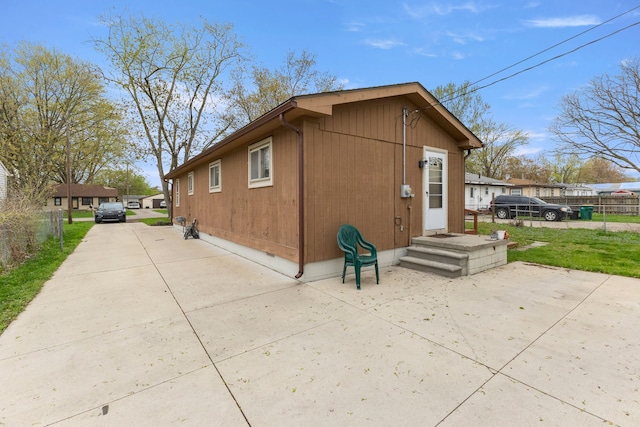 rear view of property with fence