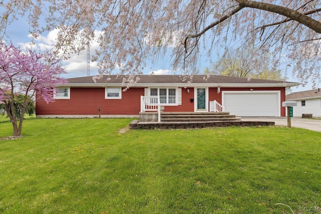ranch-style house featuring an attached garage, concrete driveway, and a front yard