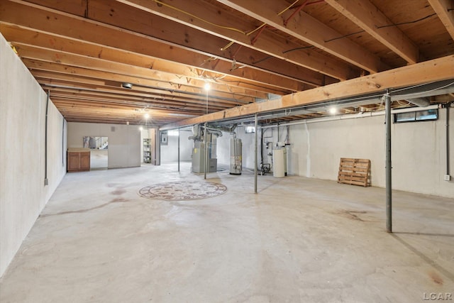 unfinished below grade area with heating unit, gas water heater, and electric panel