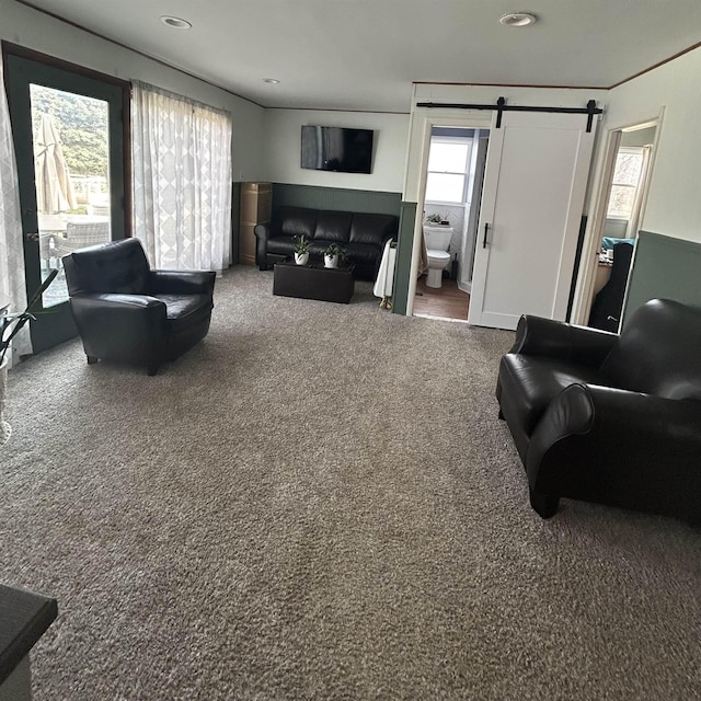 613 E Rolston, Linden, MI 48415 - living room featuring carpet flooring, recessed lighting, and a barn door
