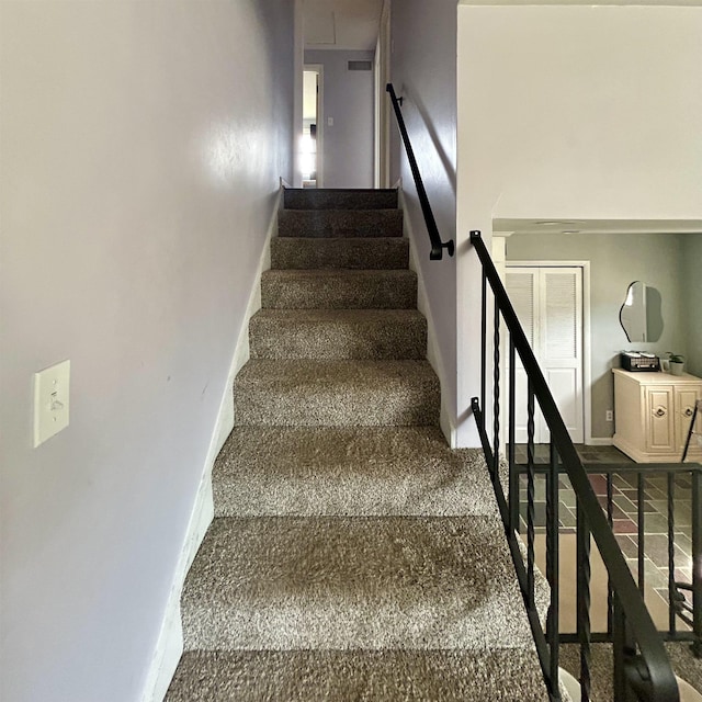 613 E Rolston, Linden, MI 48415 - staircase with carpet floors and baseboards