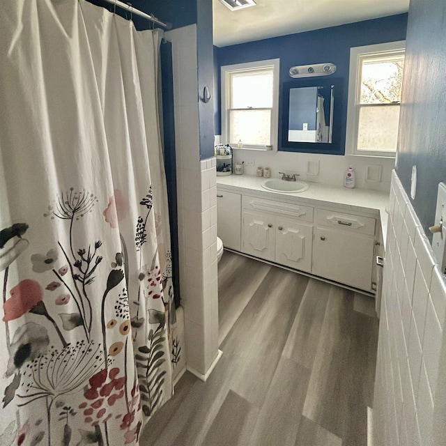 613 E Rolston, Linden, MI 48415 - bathroom featuring visible vents, a healthy amount of sunlight, wood finished floors, and vanity