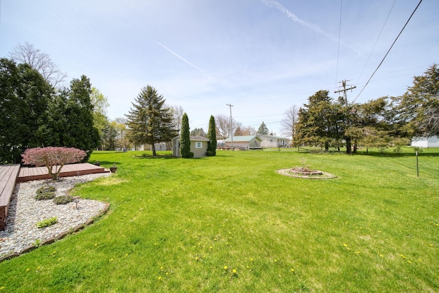 view of yard with a fire pit and a wooden deck