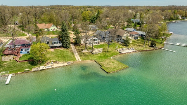 birds eye view of property featuring a water view and a forest view