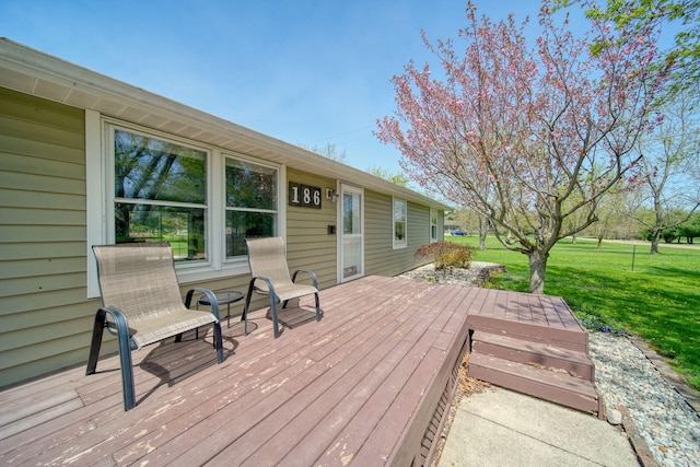 wooden terrace with a yard