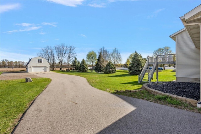 exterior space featuring driveway and stairs