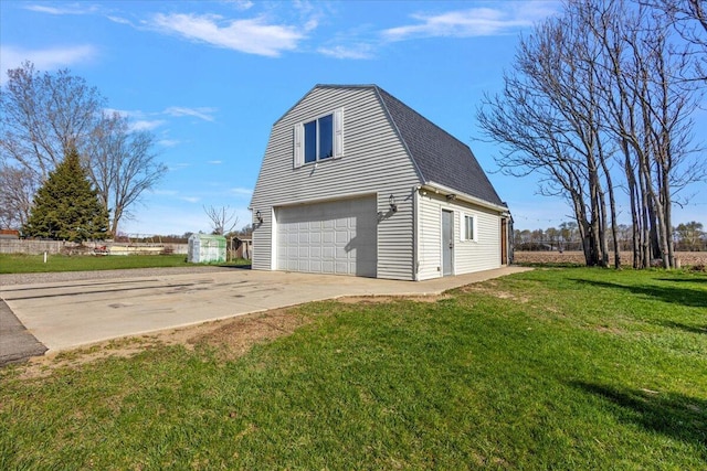 view of property exterior with fence, roof with shingles, a lawn, an outbuilding, and a detached garage