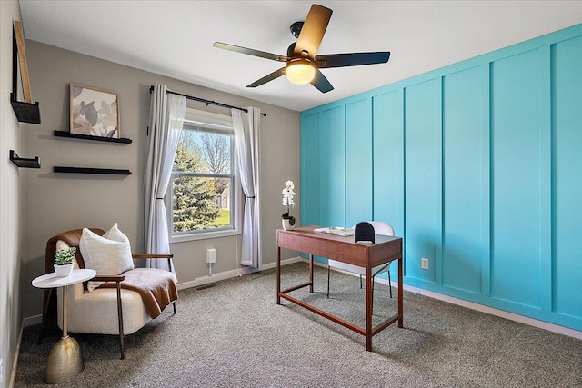 carpeted office with baseboards, a ceiling fan, and visible vents
