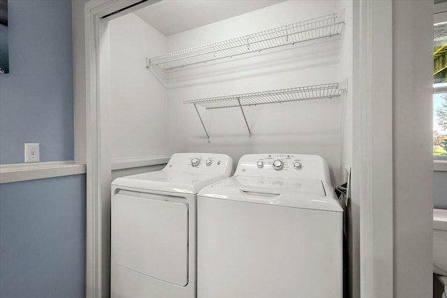 clothes washing area with laundry area and washer and dryer