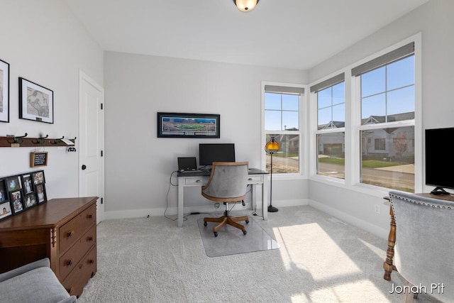 carpeted office with baseboards