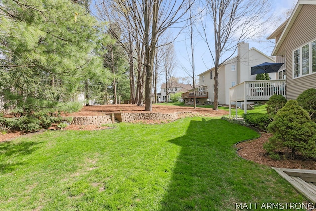 view of yard featuring a wooden deck