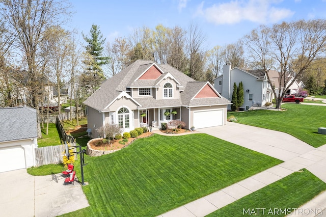 view of front of property featuring a front lawn, fence, covered porch, a shingled roof, and driveway