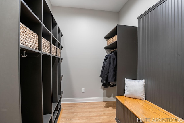 interior space featuring light wood-type flooring and baseboards