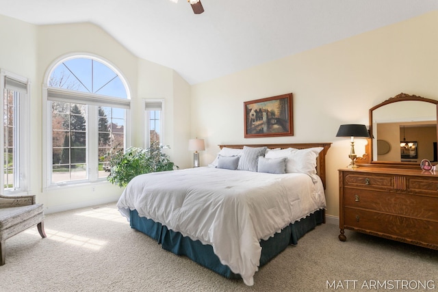 bedroom with carpet floors, a ceiling fan, baseboards, and lofted ceiling