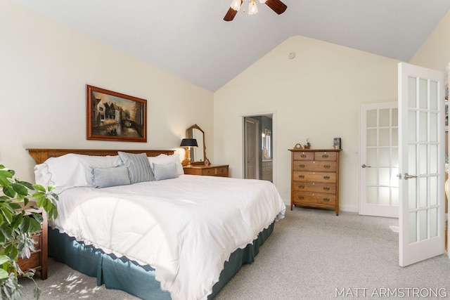 bedroom with carpet flooring, high vaulted ceiling, french doors, a ceiling fan, and ensuite bathroom