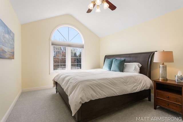 carpeted bedroom featuring a ceiling fan, baseboards, and lofted ceiling