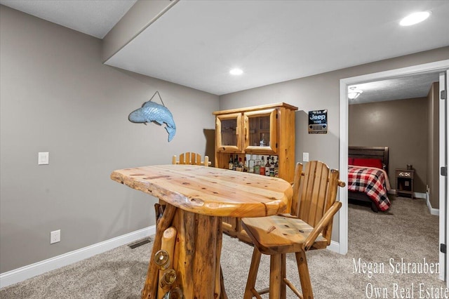 dining area with baseboards, recessed lighting, carpet, and visible vents