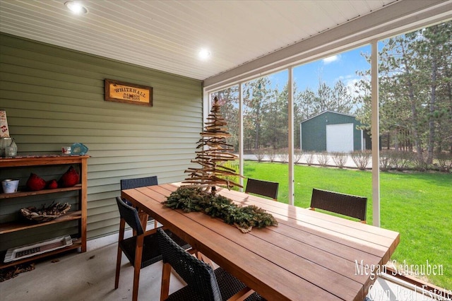 sunroom / solarium featuring outdoor dining area