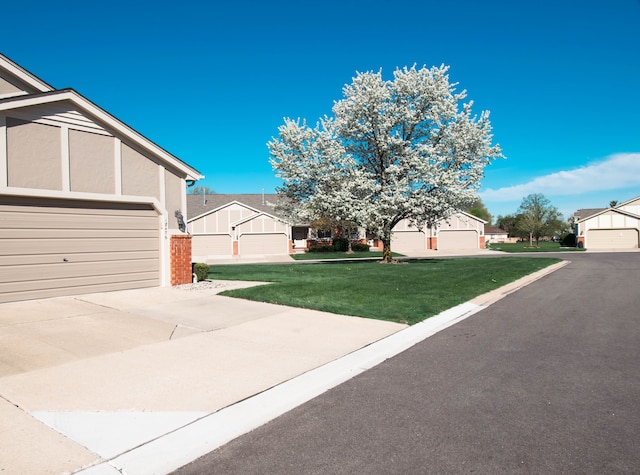 exterior space with a lawn and a garage