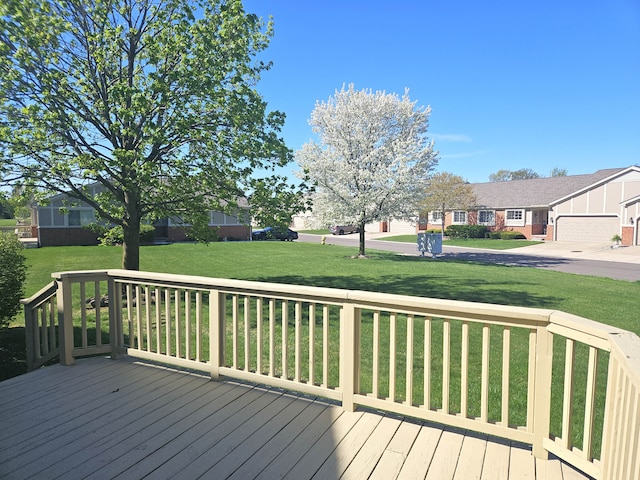 wooden terrace with a yard