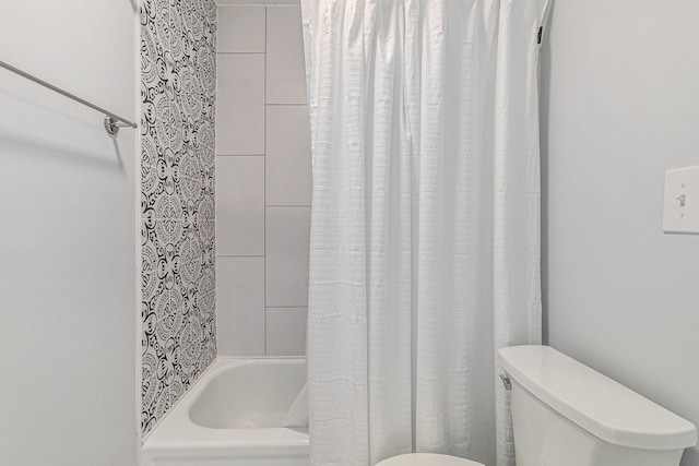 full bath featuring shower / bath combo and toilet