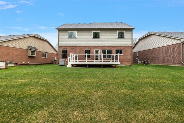 29816 Trailwood Dr, Warren, MI 48092 - back of house with central air condition unit, a yard, brick siding, and a deck