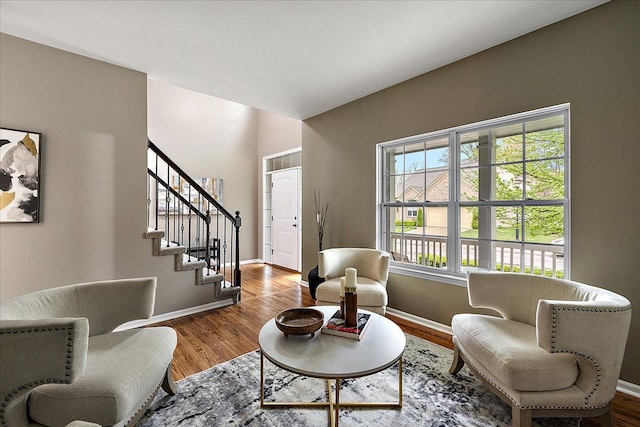 29816 Trailwood Dr, Warren, MI 48092 - living area featuring baseboards, stairs, and wood finished floors