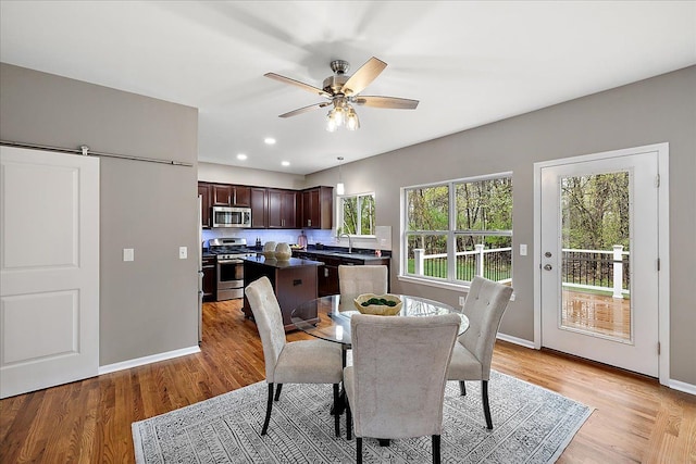 29816 Trailwood Dr, Warren, MI 48092 - dining space with light wood-style floors, ceiling fan, baseboards, and recessed lighting