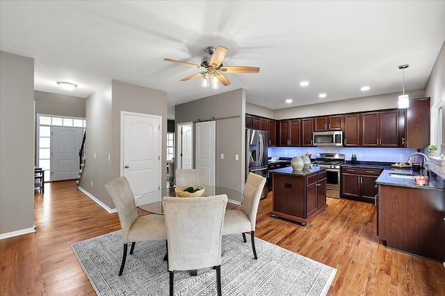29816 Trailwood Dr, Warren, MI 48092 - dining area with light wood-style floors, healthy amount of natural light, a ceiling fan, baseboards, and recessed lighting