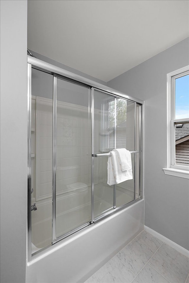 29816 Trailwood Dr, Warren, MI 48092 - bathroom featuring bath / shower combo with glass door, baseboards, and marble finish floors