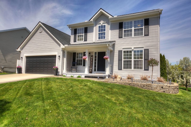 view of front of home featuring a garage, covered porch, concrete driveway, and a front lawn