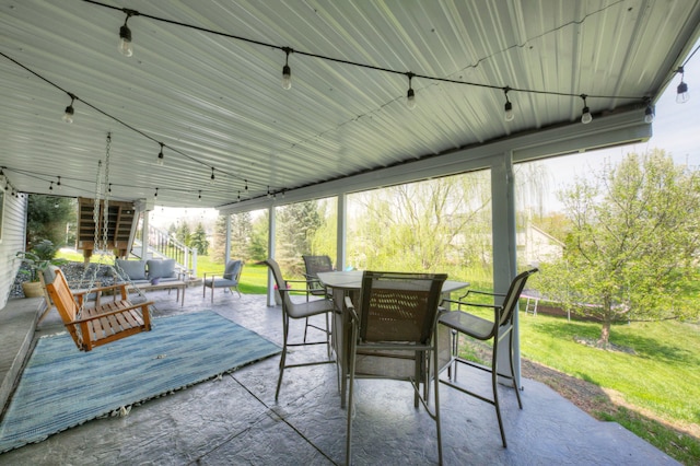 sunroom / solarium with an outdoor hangout area and outdoor dining area