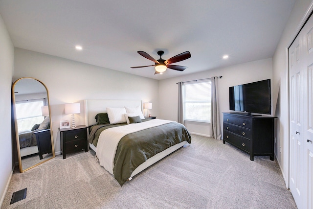 bedroom with ceiling fan, light colored carpet, recessed lighting, baseboards, and visible vents