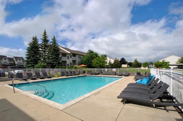 pool featuring a patio and fence