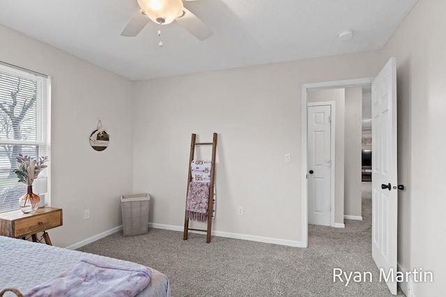 bedroom featuring carpet floors, a ceiling fan, and baseboards