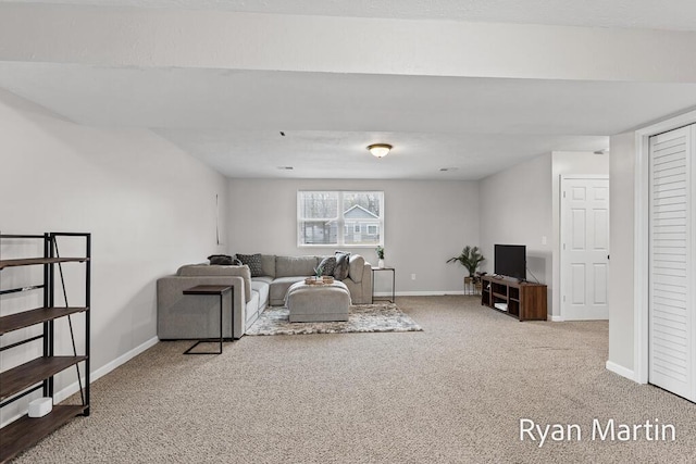 living room featuring baseboards and carpet