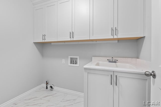 laundry room featuring cabinet space, washer hookup, a sink, marble finish floor, and hookup for a gas dryer