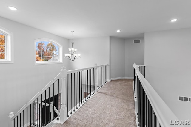 hallway featuring carpet flooring, recessed lighting, and visible vents