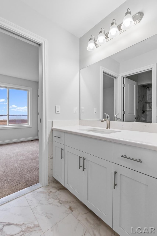 bathroom featuring vanity and marble finish floor