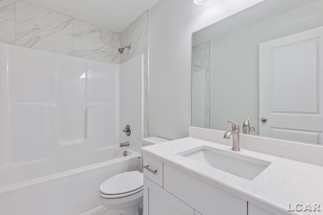 bathroom with shower / bath combination, vanity, and toilet